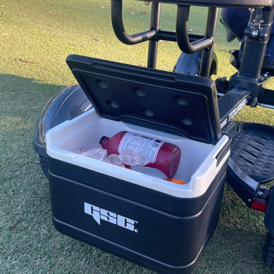 Black cooler attached to the GSC Tourer X on a grassy field